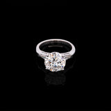 Platinum Round Brilliant Cut Diamond Solitaire Ring With Tapered Baguette Diamonds