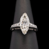 Platinum Marquise Diamond Ring With Channel Set French Cut Accent Diamonds, Circa 1950