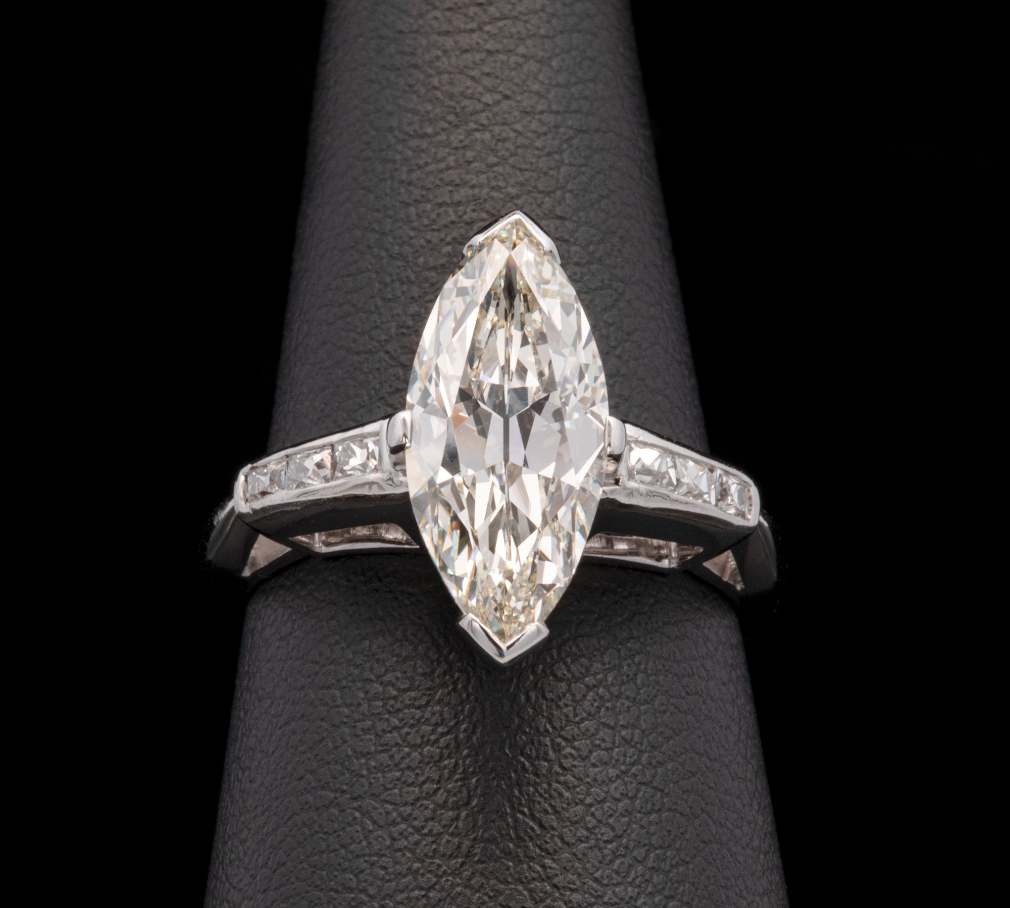Platinum Marquise Diamond Ring With Channel Set French Cut Accent Diamonds, Circa 1950