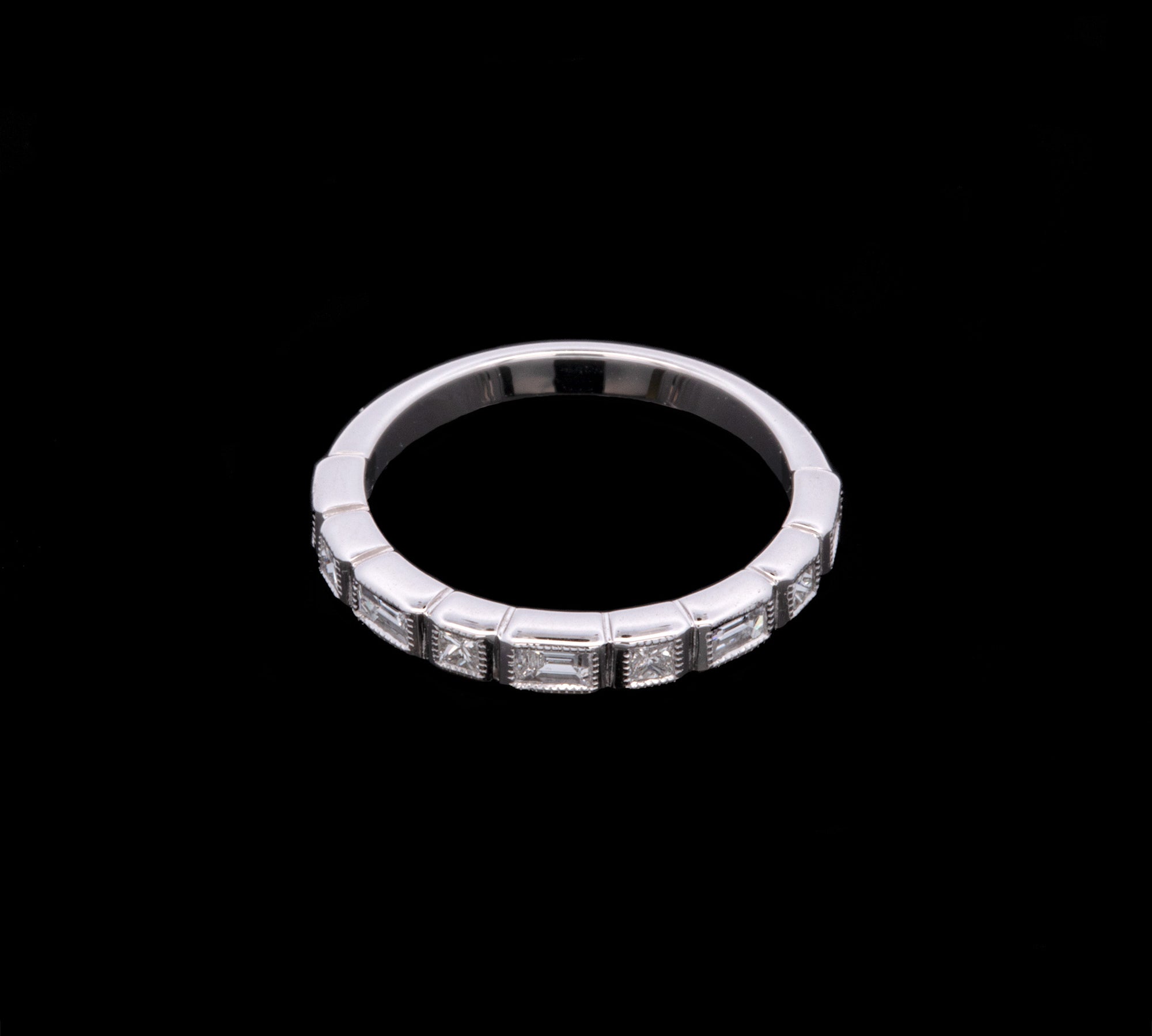 18K White Gold Bezel Set Baguette And Princess Cut Nine Stone Diamond Ring