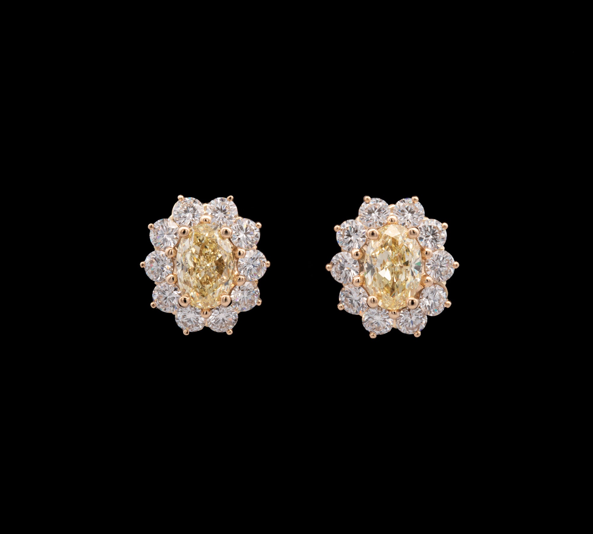 18K Yellow Gold Fancy Yellow Oval Diamond Stud Earrings With Diamond Halos