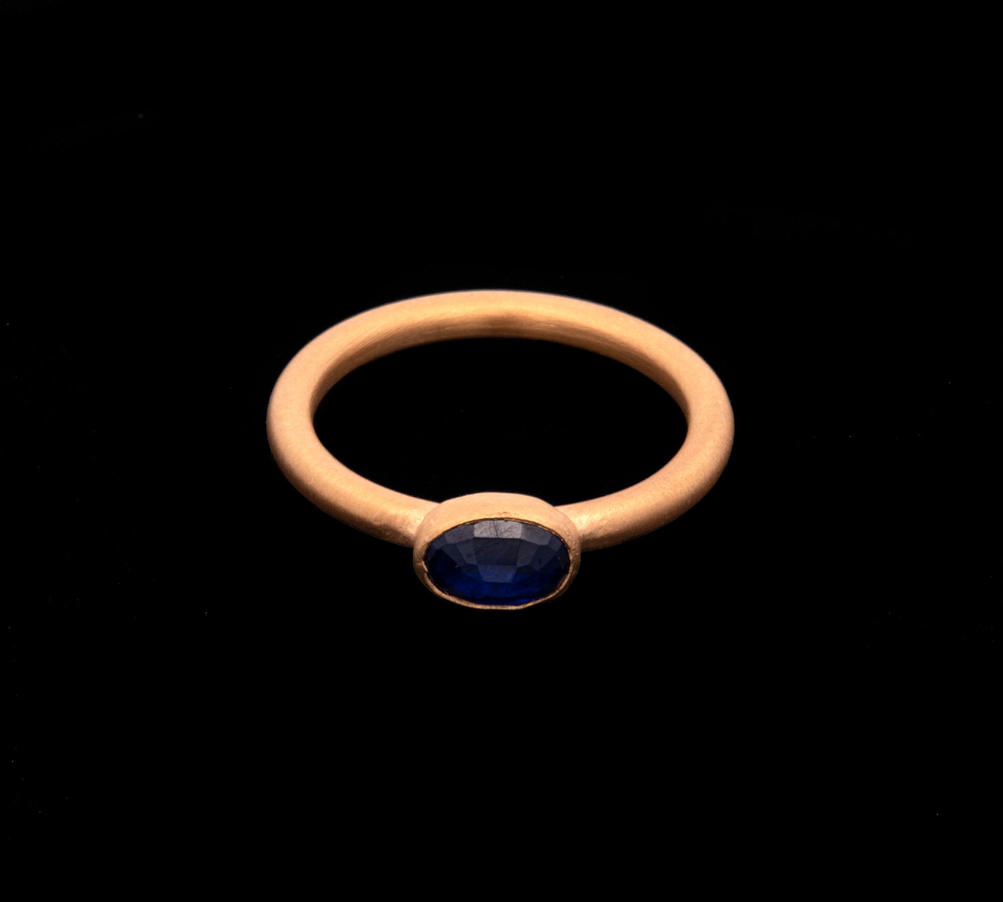 24K Yellow Gold Bezel Set Oval Sapphire Ring
