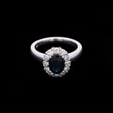 18K White Gold Oval Sapphire And Diamond Halo Ring