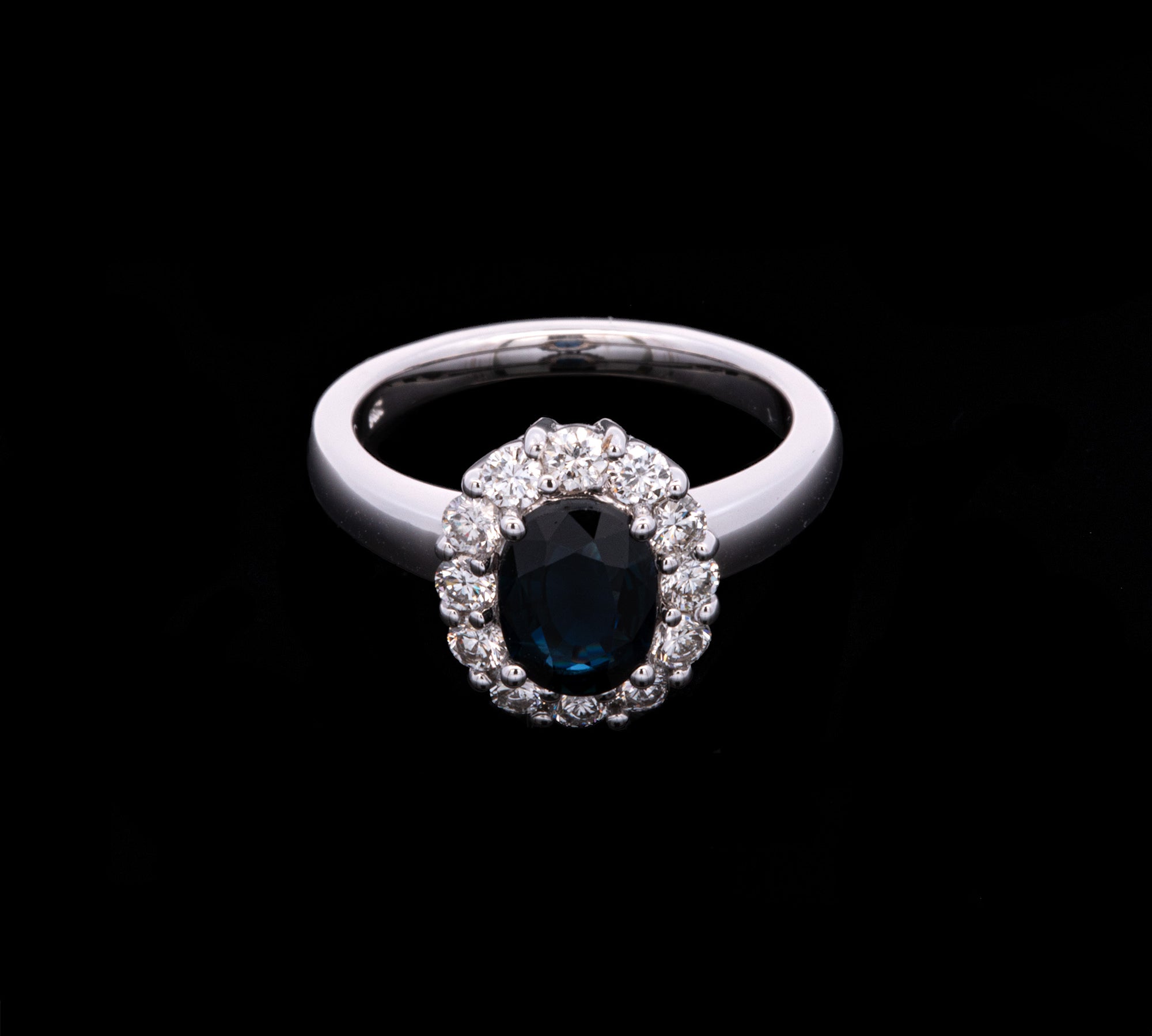 18K White Gold Oval Sapphire And Diamond Halo Ring