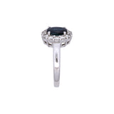 18K White Gold Oval Sapphire And Diamond Halo Ring