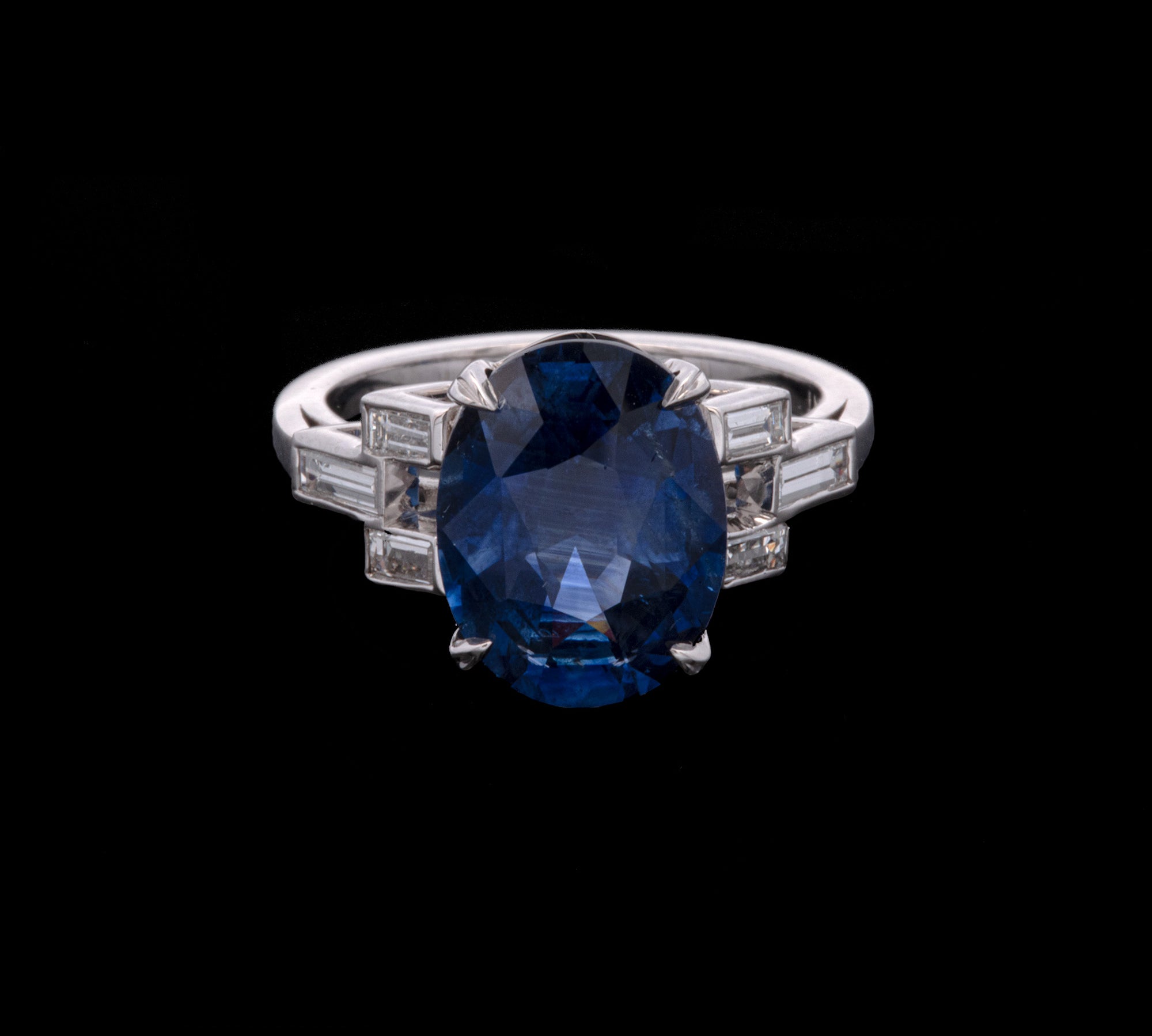 Platinum Oval Sapphire And Baguette Diamond Ring