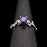 14K White Gold Tanzanite And Offset Marquise Cut Diamond Ring