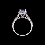 14K White Gold Emerald Cut Tanzanite And Diamond Halo Split Shank Ring
