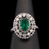 14K White Gold Emerald And Triple Diamond Halo Ring