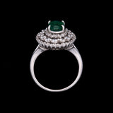 14K White Gold Emerald And Triple Diamond Halo Ring