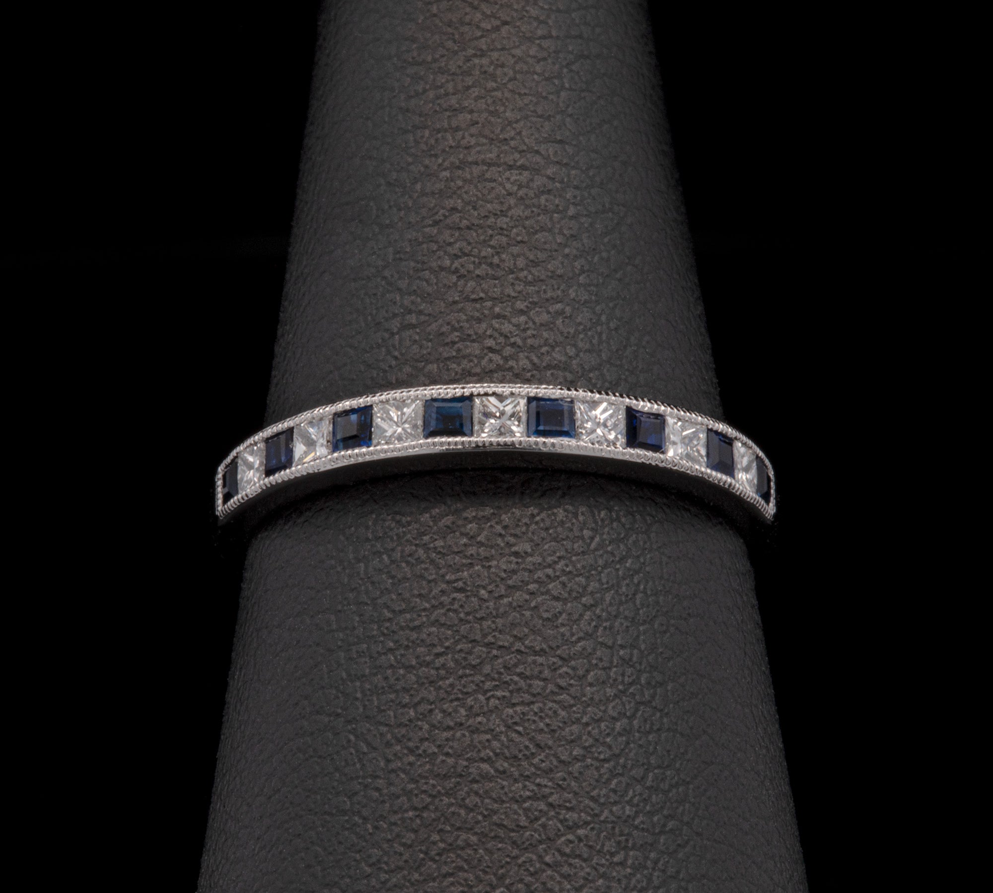 18K White Gold Channel Set Princess Cut Sapphire And Diamond Half Eternity Band With Milgrain Edge
