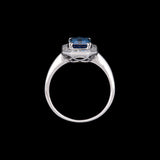 18K White Gold Emerald Cut Sapphire And Baguette Diamond Halo Ring