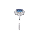 18K White Gold Emerald Cut Sapphire And Baguette Diamond Halo Ring