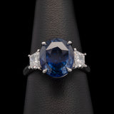 Platinum Oval Sapphire And Trapezoid Diamond Ring