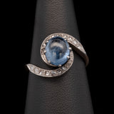 18K Yellow Gold And Platinum Edwardian Cabochon Sapphire And Rose Cut Diamond Swirl Ring