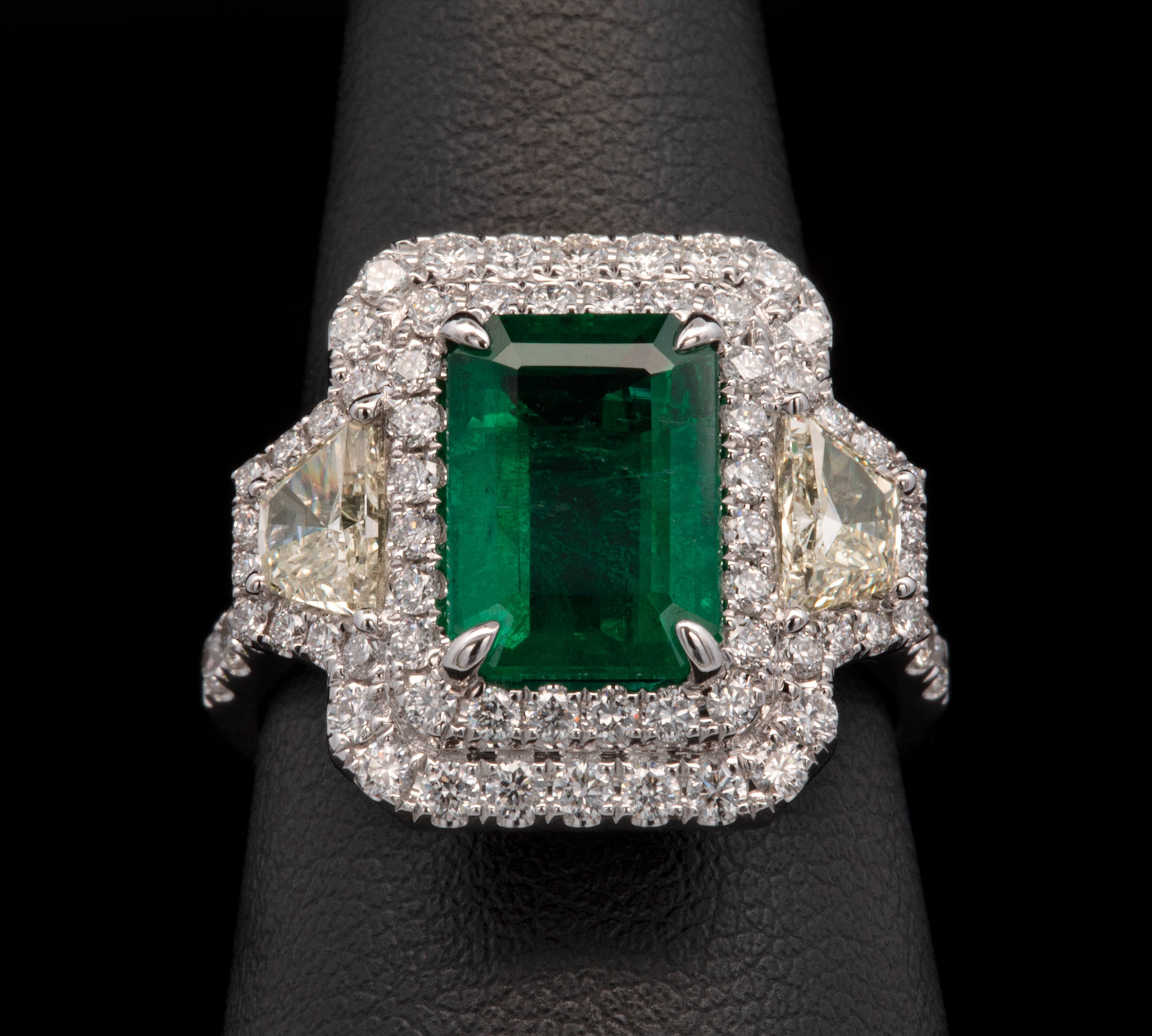 18K White Gold Emerald And Diamond Double Halo Ring With Light Fancy Yellow Trapezoid Cut Diamonds
