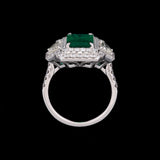 18K White Gold Emerald And Diamond Double Halo Ring With Light Fancy Yellow Trapezoid Cut Diamonds