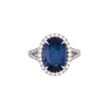 18K White Gold Oval Sapphire And Diamond Halo Ring