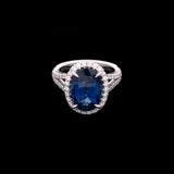 18K White Gold Oval Sapphire And Diamond Halo Ring