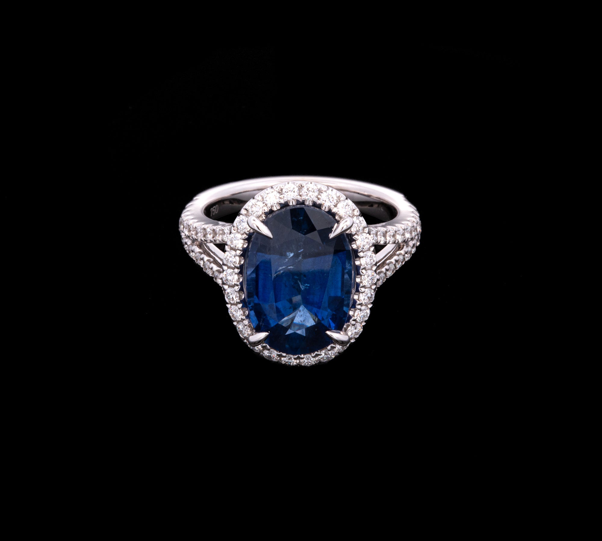 18K White Gold Oval Sapphire And Diamond Halo Ring