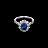 18K White Gold Oval Sapphire And Diamond Halo Ring