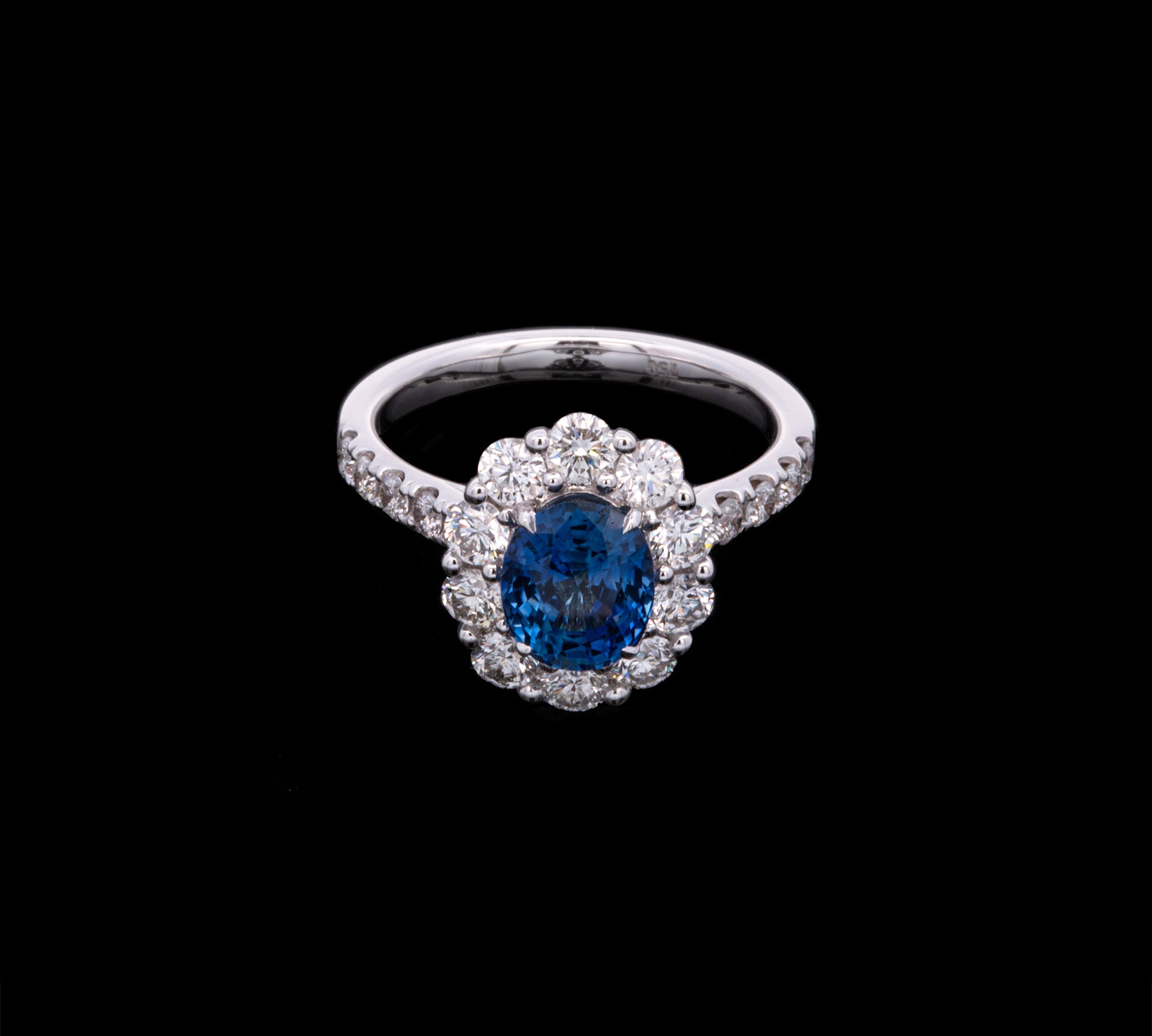 18K White Gold Oval Sapphire And Diamond Halo Ring