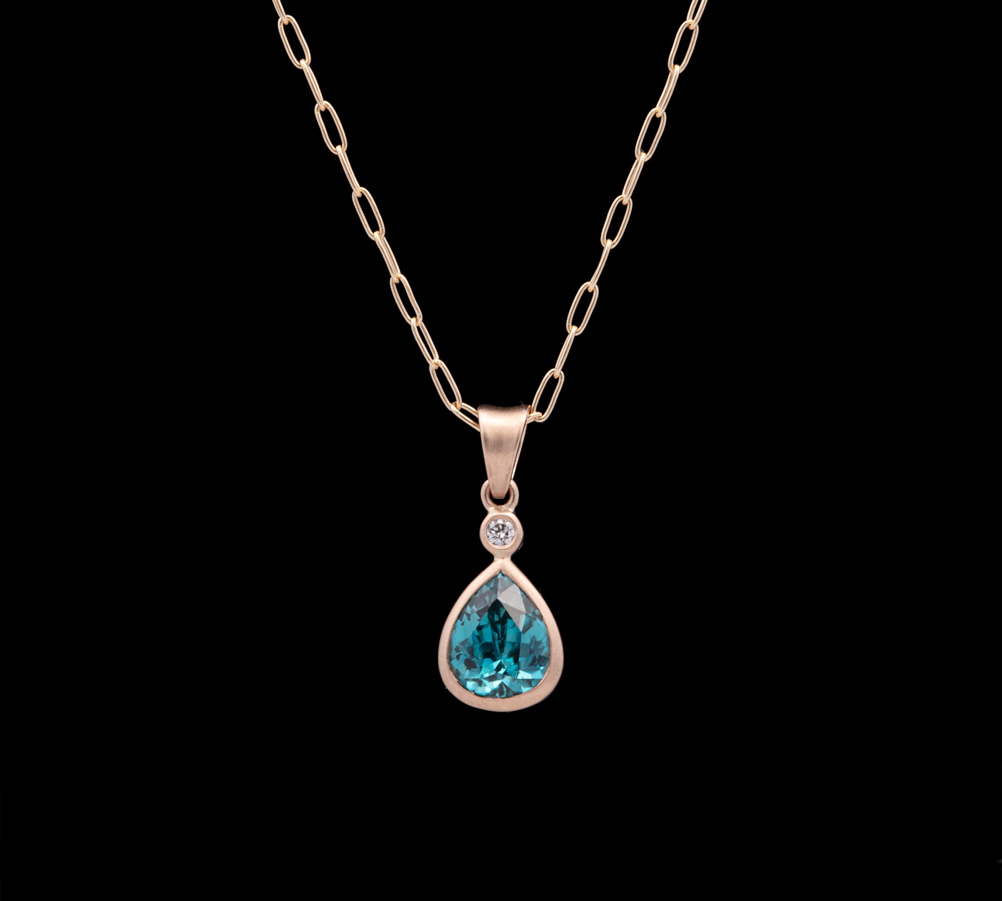 14K Yellow Gold Blue Zircon Bezel Set Pendant And 18K Yellow Gold 1.4mm Oval Link Chain, 18 Inches