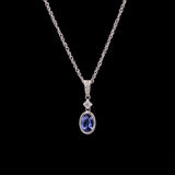 14K White Gold Bezel Set Tanzanite And Diamond Pendant With 18 Inch Cable Chain