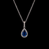14K White Gold Ceylon Sapphire And Diamond Halo Pendant With 18 Inch Cable Chain.