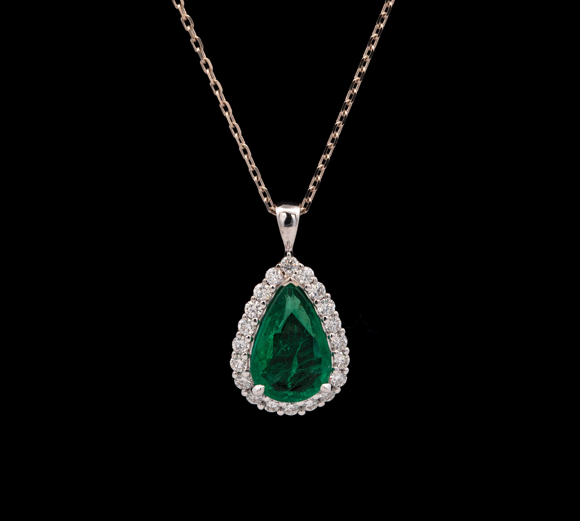 18K White Gold Pear Cut Emerald And Diamond Halo Pendant With 18 Inch Cable Chain