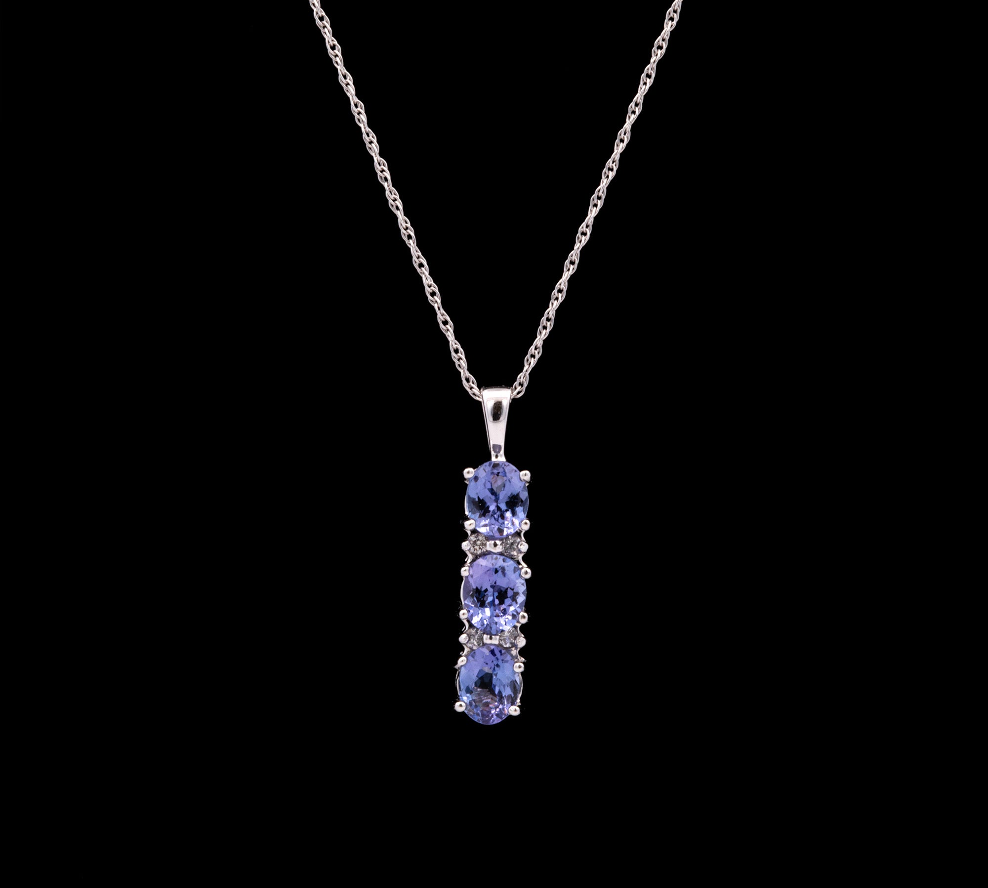 14K White Gold Three Stone Tanzanite Pendant With Diamond Accents And 18 Inch Chain