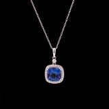 14K White Gold Tanzanite And Diamond Halo Pendant With 18 Inch Chain