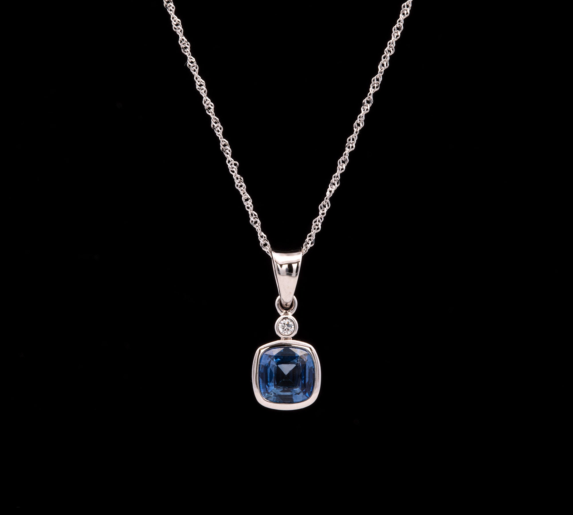 14K White Gold Bezel Set Cushion Cut Ceylon Sapphire And Diamond Pendant With 18 Inch Chain