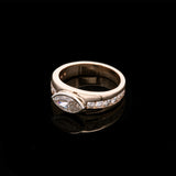 Custom 14K Yellow And White Gold Tapered Ring With Bezel Set Marquise Diamond And Channel Set Round Brilliant Cut Accent Diamonds