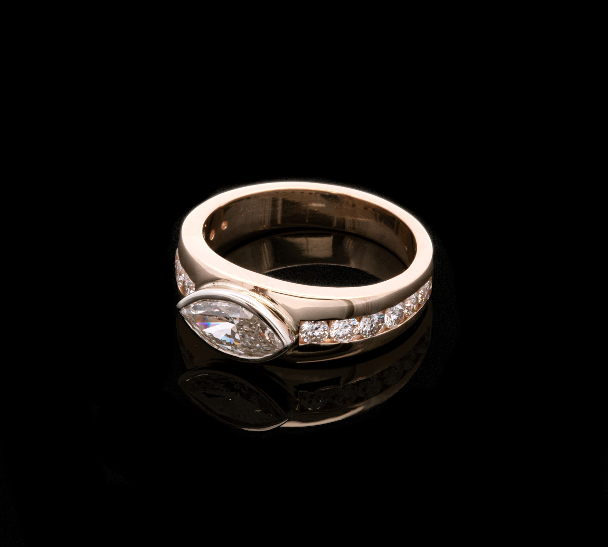 Custom 14K Yellow And White Gold Tapered Ring With Bezel Set Marquise Diamond And Channel Set Round Brilliant Cut Accent Diamonds