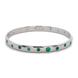Custom 14K White Gold Sold Bangle Bracelet With Flush Set Emerald