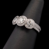 Custom Platinum Bezel Set Three Stone Engagement Ring With Diamond Halos And Matching Eternity Band