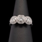 Custom Platinum Bezel Set Three Stone Engagement Ring With Diamond Halos And Matching Eternity Band