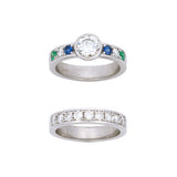 Custom Platinum Bezel Set Round Diamond Solitaire Ring With Channel Set Sapphire, Diamond, Emerald And Matching Channel Set Diamond Half Band