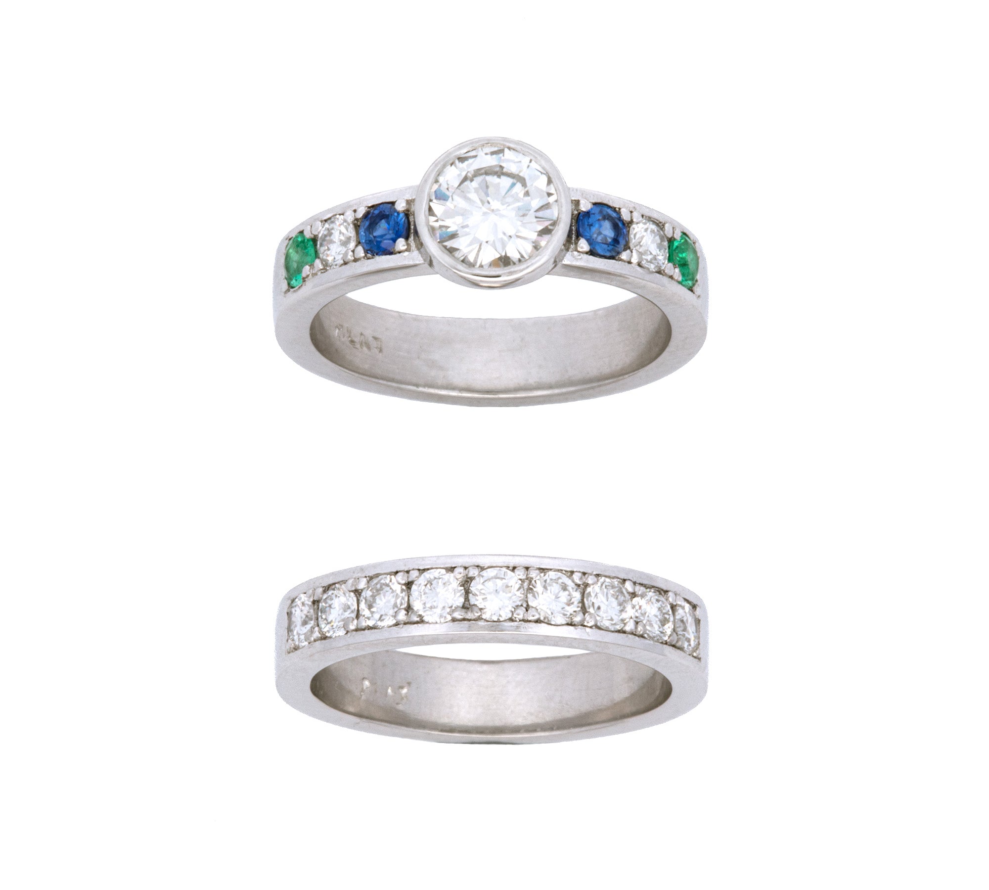Custom Platinum Bezel Set Round Diamond Solitaire Ring With Channel Set Sapphire, Diamond, Emerald And Matching Channel Set Diamond Half Band